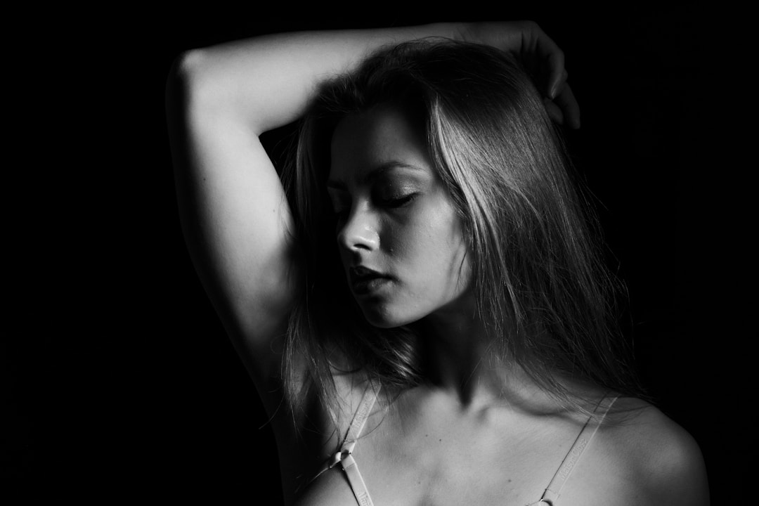 a black and white photo of a woman with long hair